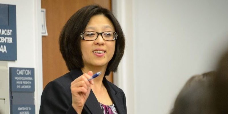 Fei Wang, associate clinical professor of pharmacy practice lectures at the Pharmacy/Biology Building on May 1, 2015. (Peter Morenus/UConn Photo)