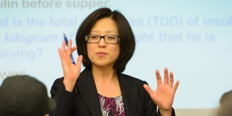 Fei Wang, associate clinical professor of pharmacy practice lectures at the Pharmacy/Biology Building on May 1, 2015. (Peter Morenus/UConn Photo)